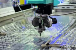 A high-pressure waterjet cutting technology, cutting a complex titanium aerospace component in a Texas.